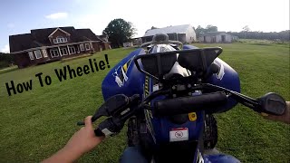 How to Wheelie a Automatic Four Wheeler [upl. by Nawuj688]